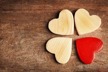 Wooden hearts on rustic wooden background