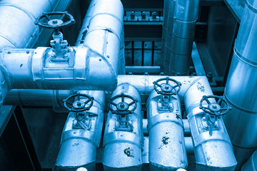 Equipment, cables and piping as found inside of combined cycle power plant (Blue tone)