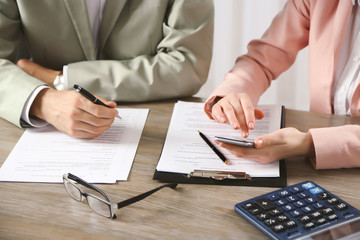 Human hands working with documents at the desk closeup