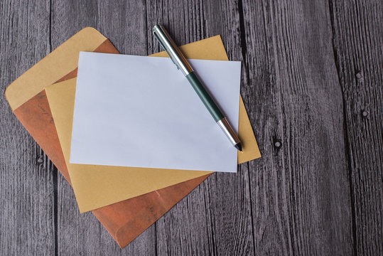 Letter with envelopes and pen