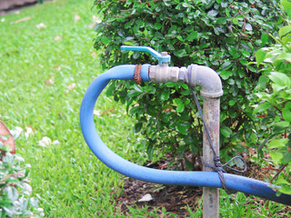 plastic tube and tap in the garden