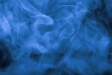 Cloud of smoke on black background. Defocused. Toned