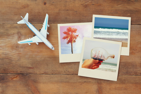 top view of travel instant photographs next to airplane