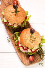 home made burger on vintage wooden background