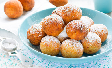 Small donuts with powdered sugar