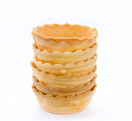 Stack of empty tartlets isolated