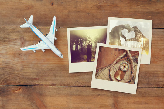 top view of travel instant photographs next to airplane
