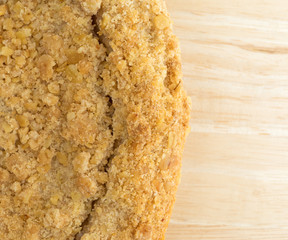 Dutch apple pie on a wood table top close view.