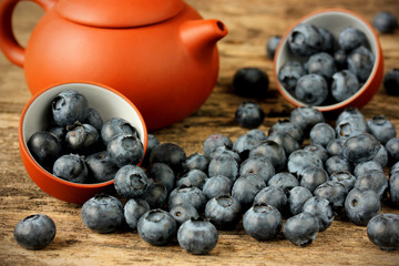 Fresh ripe blueberries on a wooden background