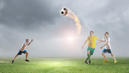 Obraz na płótnie Canvas Soccer players fighting for ball