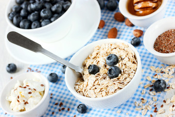 Dietary food concept - granola with blueberry, nuts, honey