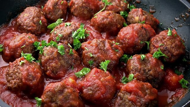 Portion of Meatballs with tomato sauce as not loopable high detailed 4K UHD footage