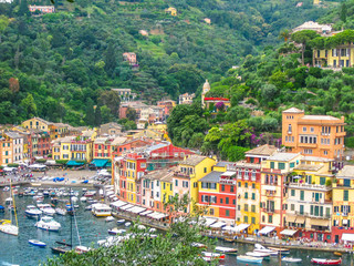 Aerial view of Portofino, a famous vacation resort with a picturesque harbor, luxury yachts and celebrity. Italian fishing village, provinces Genoa, Italy.