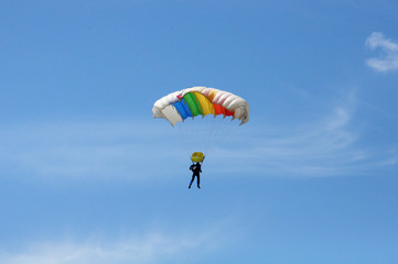 a rainbow parachute in the sky