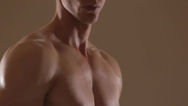 Hands of young woman touching athletic torso with abs of man. Ungraded  Stock Video | Adobe Stock
