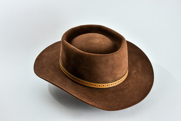 Brown felt hat or cowboy hat on white background
