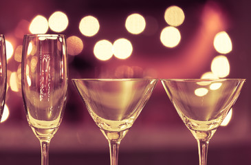 Close up of cocktail and champaign glasses in a night life setting. 