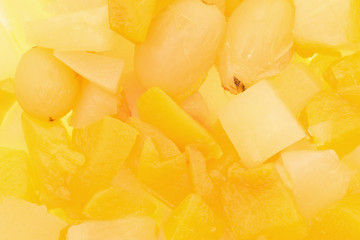 Close view of canned fruit in light syrup