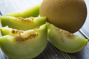Fresh melons on wooden table