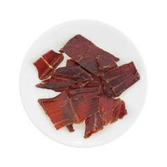Hardwood smoked beef jerky on a white plate