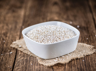 Wooden table with a portion of puffed Amaranth (selective focus)
