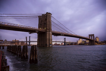 The Brooklyn Bridge in New York City from Seaport at sunrise.