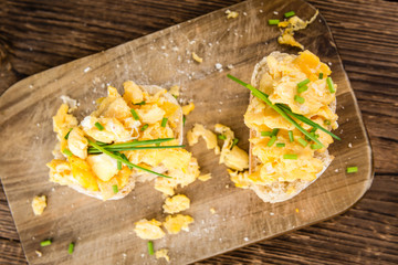 Scrambled Eggs on a bun (close-up shot)