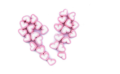 Pink broken heart marshmallow on white background