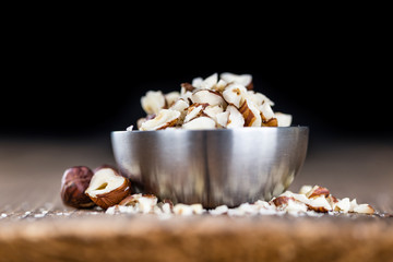 Hazelnuts (chopped, selective focus)