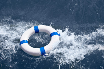 Lifebuoy, lifebelt, lifesaver in sea storm as help in danger