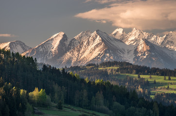 Fototapeta na wymiar Cloudy Tatra mountains in the morning over Spisz highland