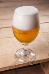 Beer glass on wood