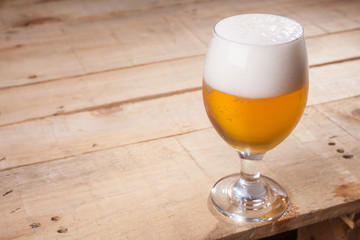 Beer glass on wood
