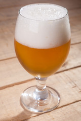 Beer glass on wood