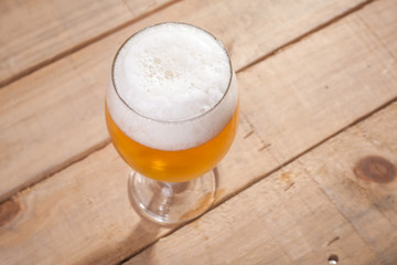 Beer glass on wood