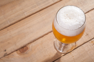 Beer glass on wood