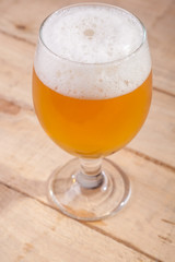 Beer glass on wood