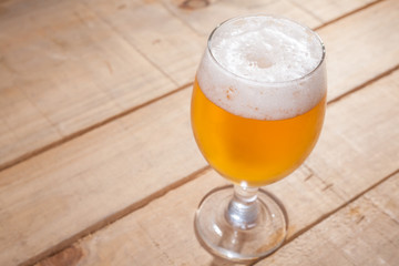 Beer glass on wood
