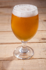 Beer glass on wood