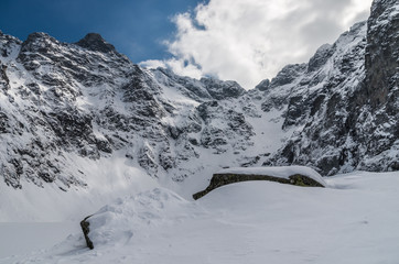 Frozen Czarny Staw (Black Pond) lake in Tatra mountains