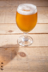 Beer glass on wood