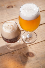 Dark and light beer on wood