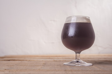 Dark beer on wood