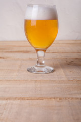 Beer glass on wood