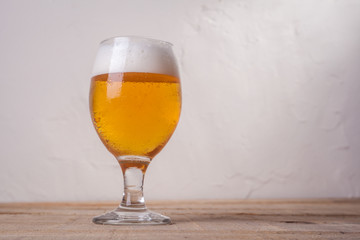 Beer glass on wood