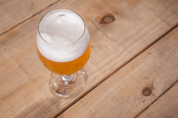 Beer glass on wood