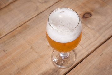Beer glass on wood