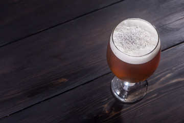 Amber ale on dark wood