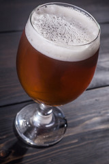 Amber ale on dark wood