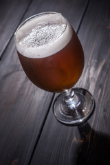 Amber ale on dark wood